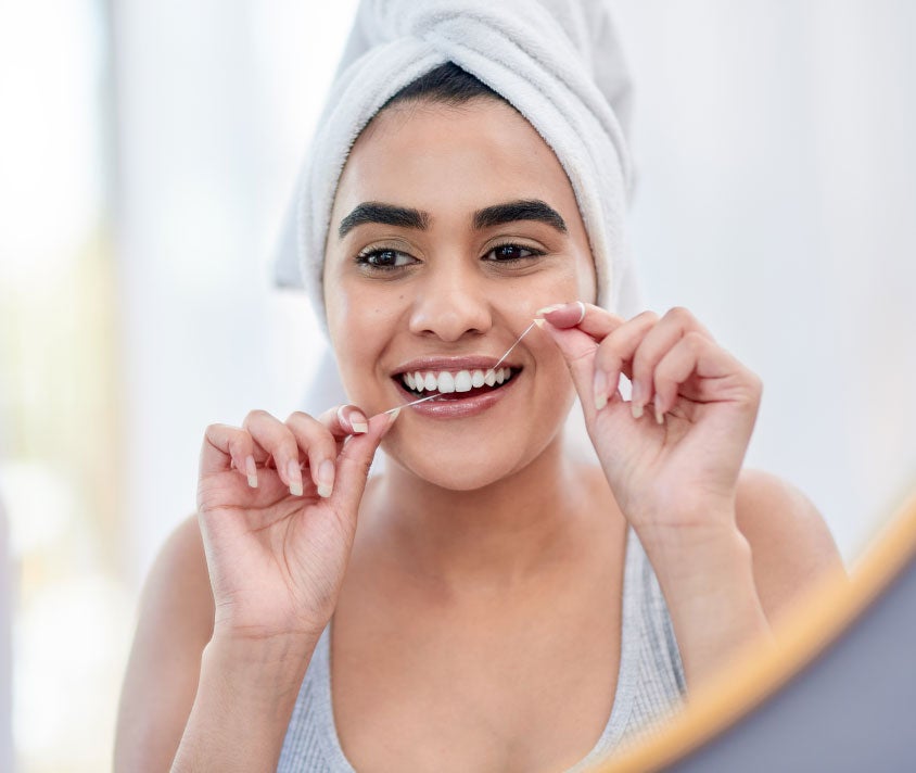Girl with dental floss