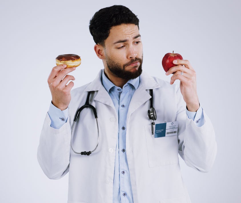 doctor holding an apple